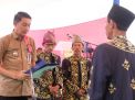 Hadiri Pengukuhan Pengurus LAM Desa Ujung Tanjung, Ini Pesan Pj Bupati Bachyuni